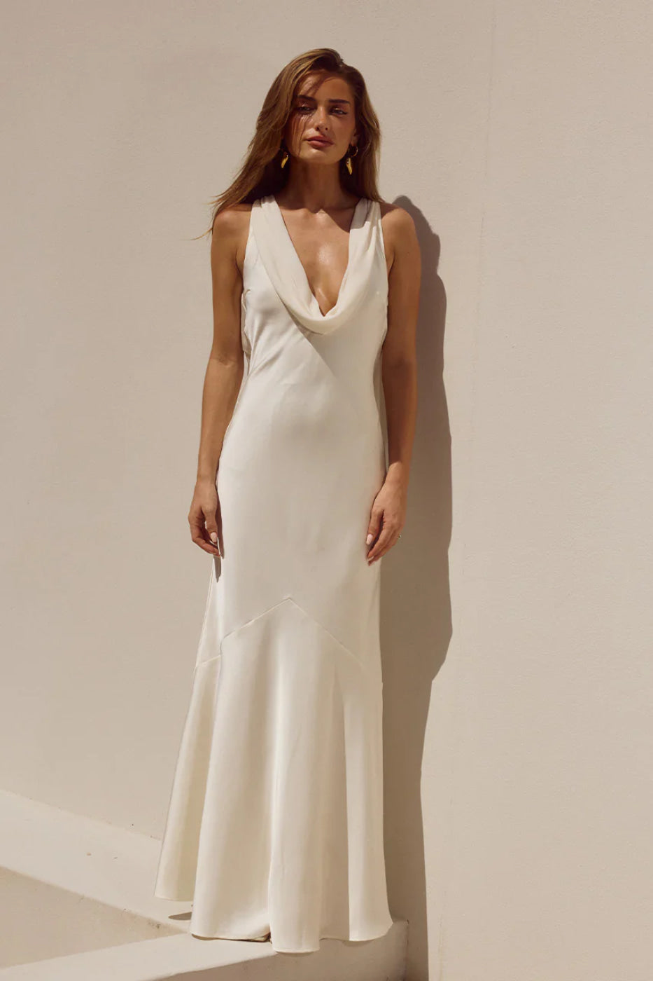 Model in Runaway The Label Gabriella Ivory cowl-neck maxi dress, satin, front view